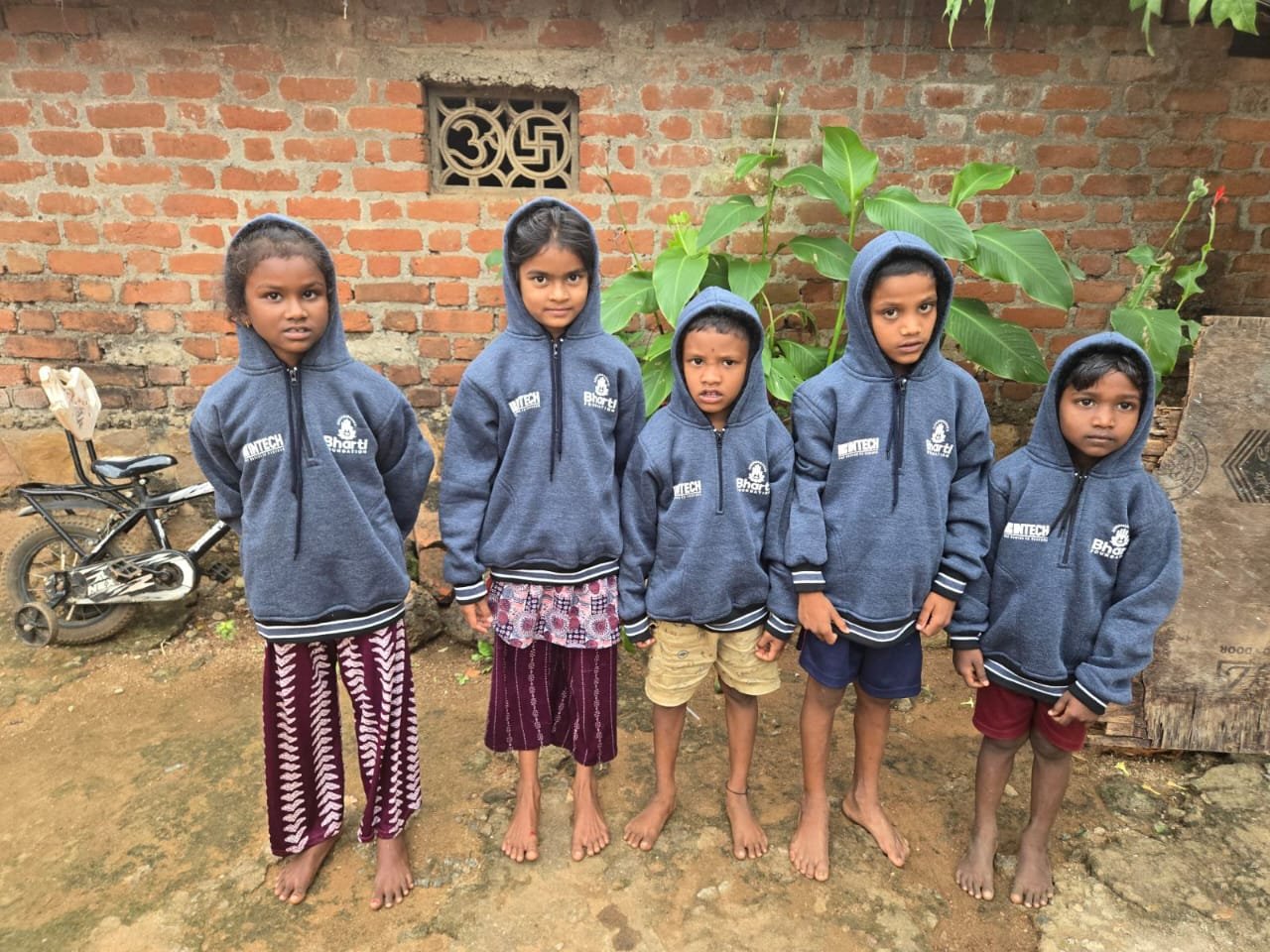 Children in warm sweaters during the Sweater Drive